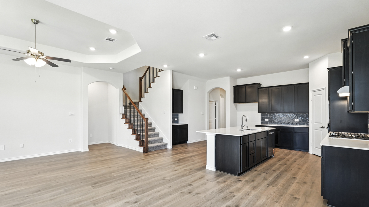 Living room with fireplace and direct access to backyard.