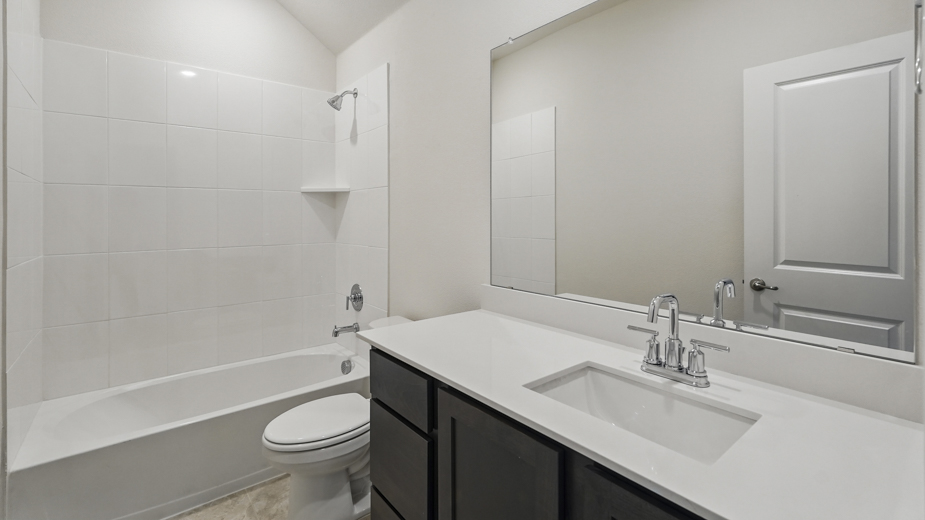 Bathroom with single sink vanity.