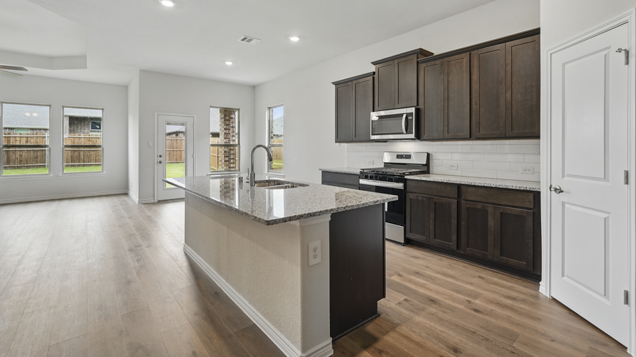 Kitchen with granite countertops and a large island.