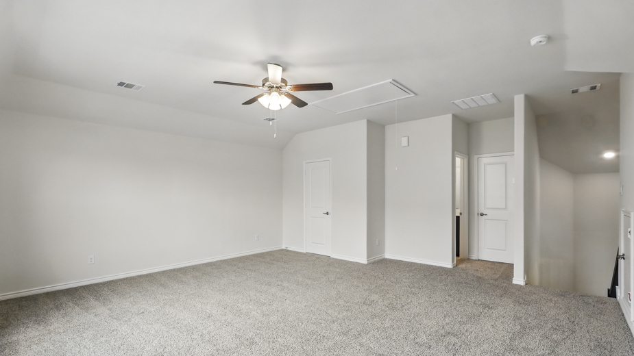 Upstairs carpeted loft area.