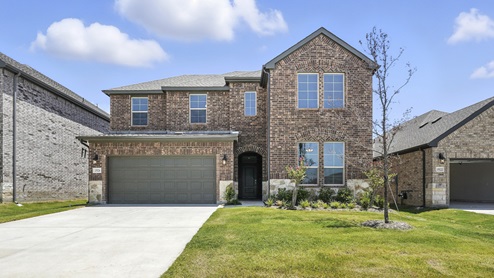 Madera spec home exterior of a brick home with two stories