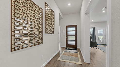 interior entrance with hardwood floors and walkway towards living area