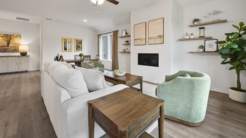 open concept living area with hardwood floors fire place