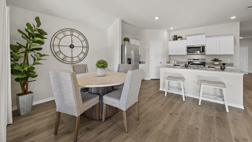kitchen with white cabinets and beige furniture