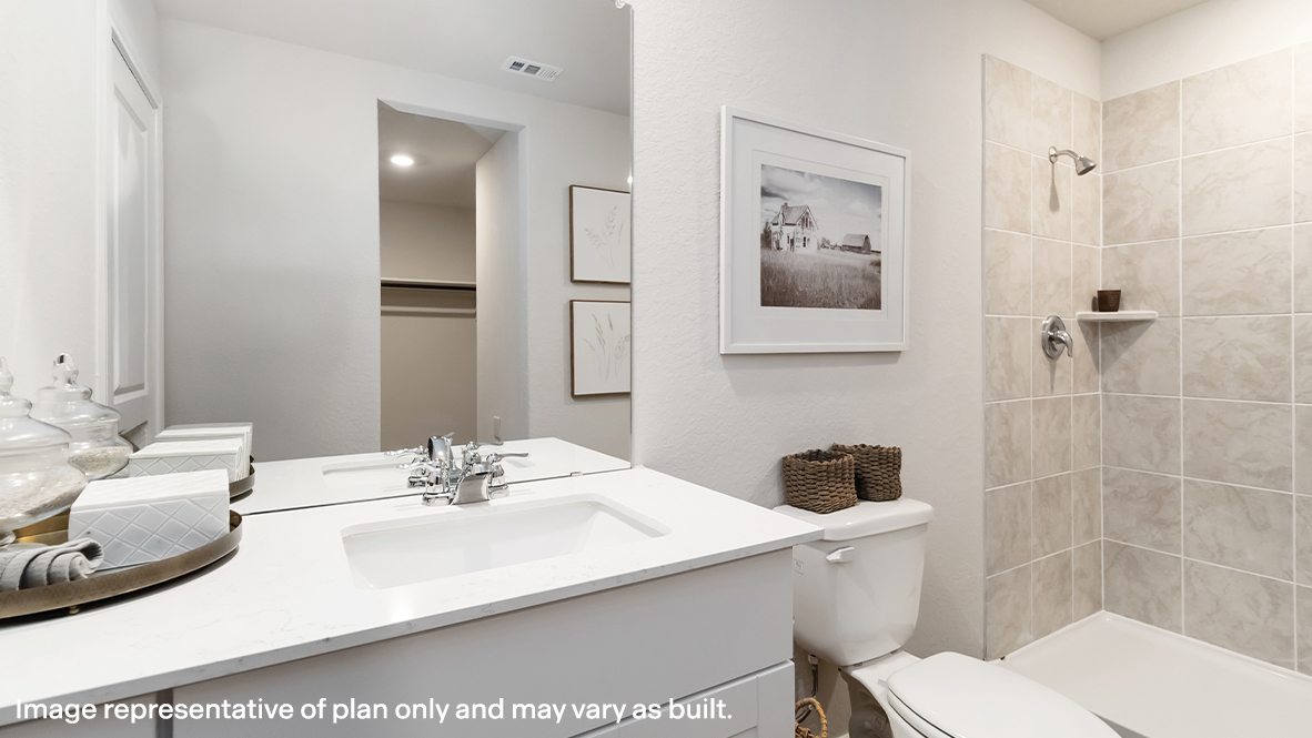 Bathroom 1 with white vanity and tub
