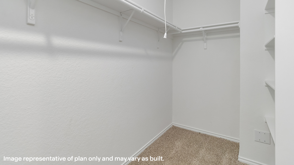 main ensuite closet with built in shelfs