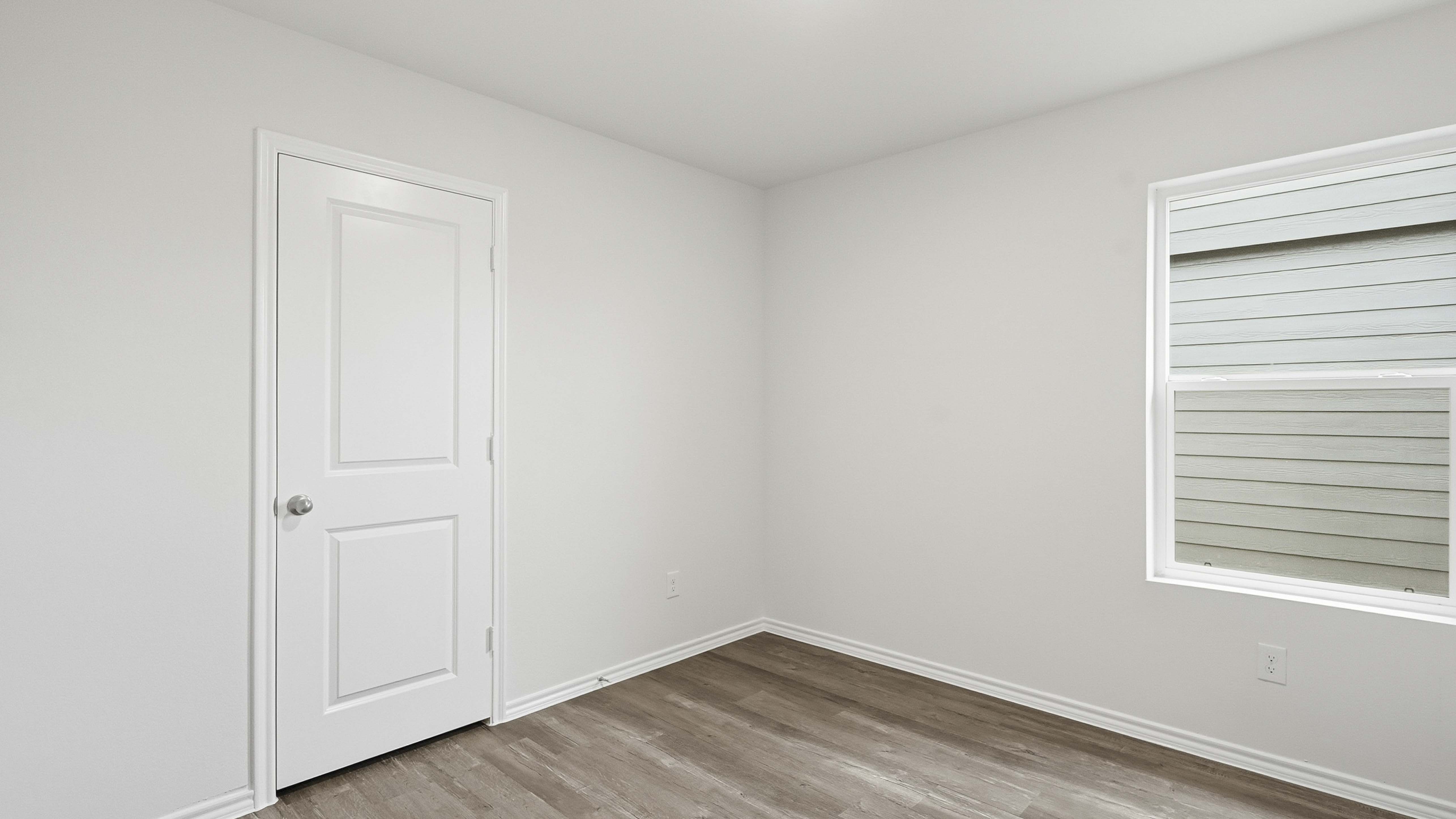 secondary bedroom with hardwood floors