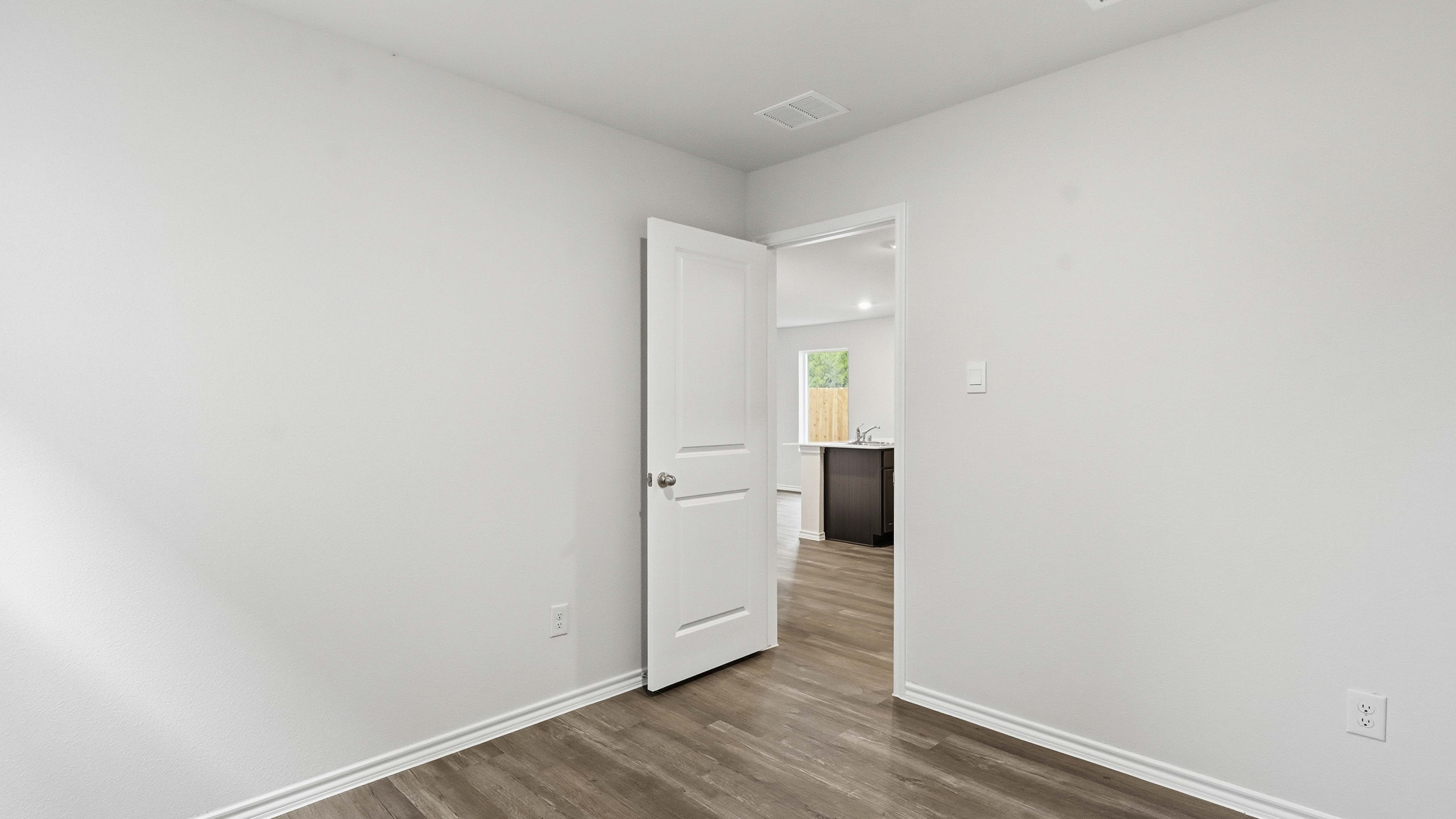 secondary bedroom with hardwood floors