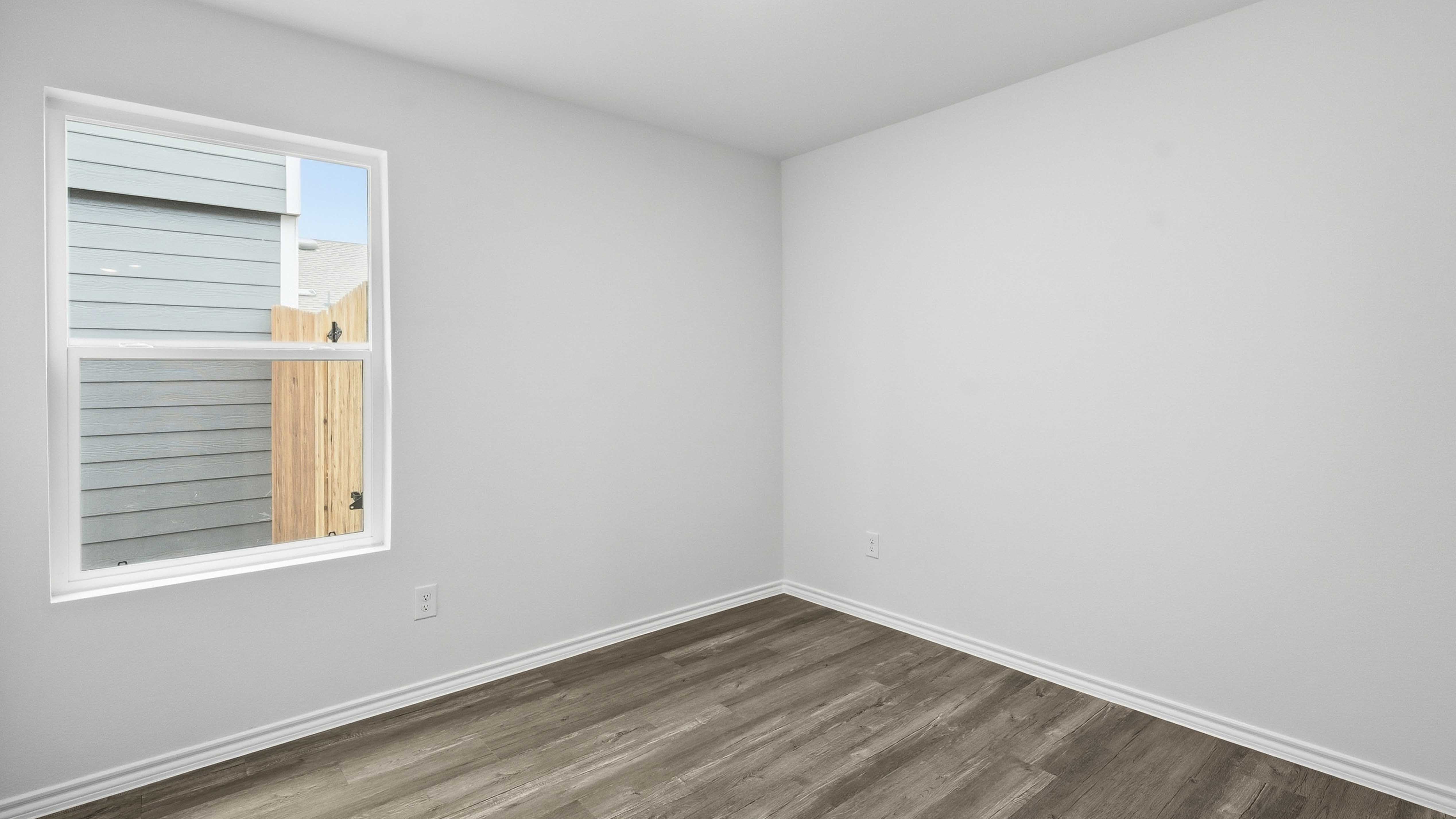 secondary bedroom with large windows