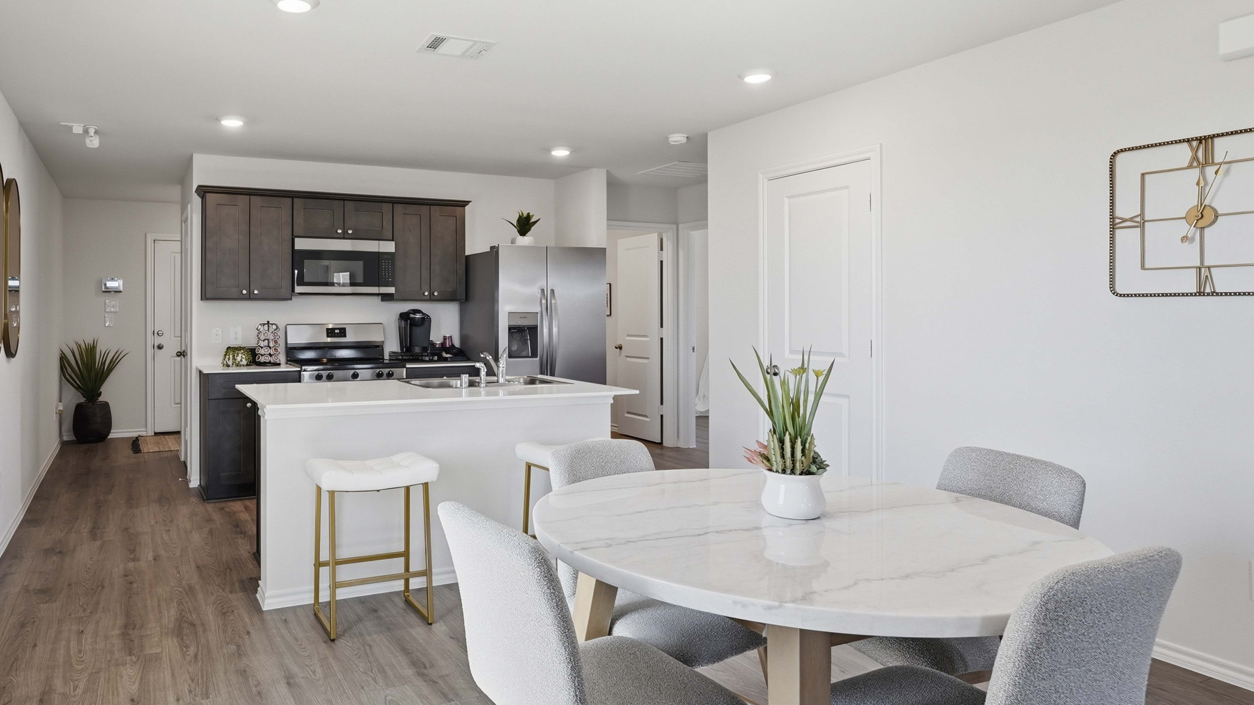 dining and kitchen area with hardwood floors