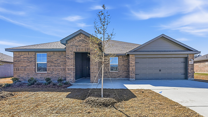 exterior of one story home with traditional brick and large windows facing the front yard