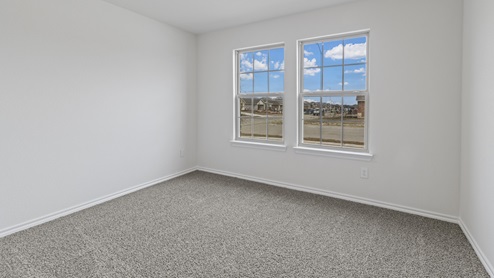Primary bedroom with double windows