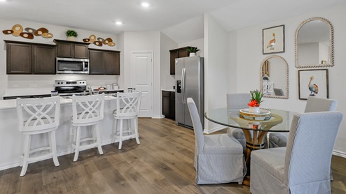 Breakfast nook table with views into kitchen