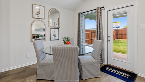 Breakfast nook table with window and back door