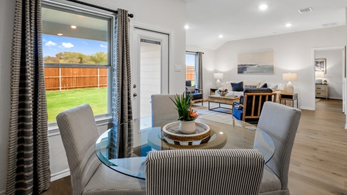 Breakfast nook with window and views into living room