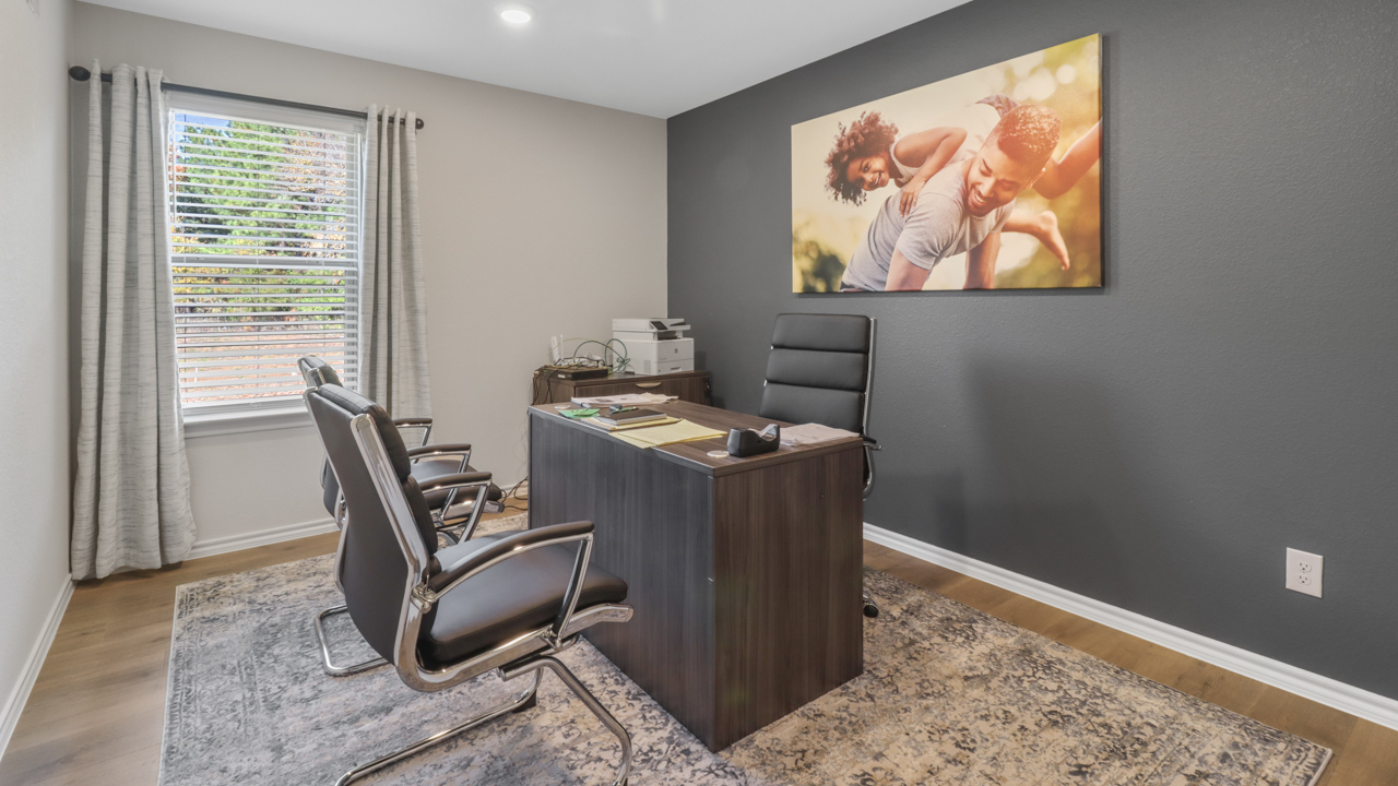 bedroom 1 with hard wood flooring