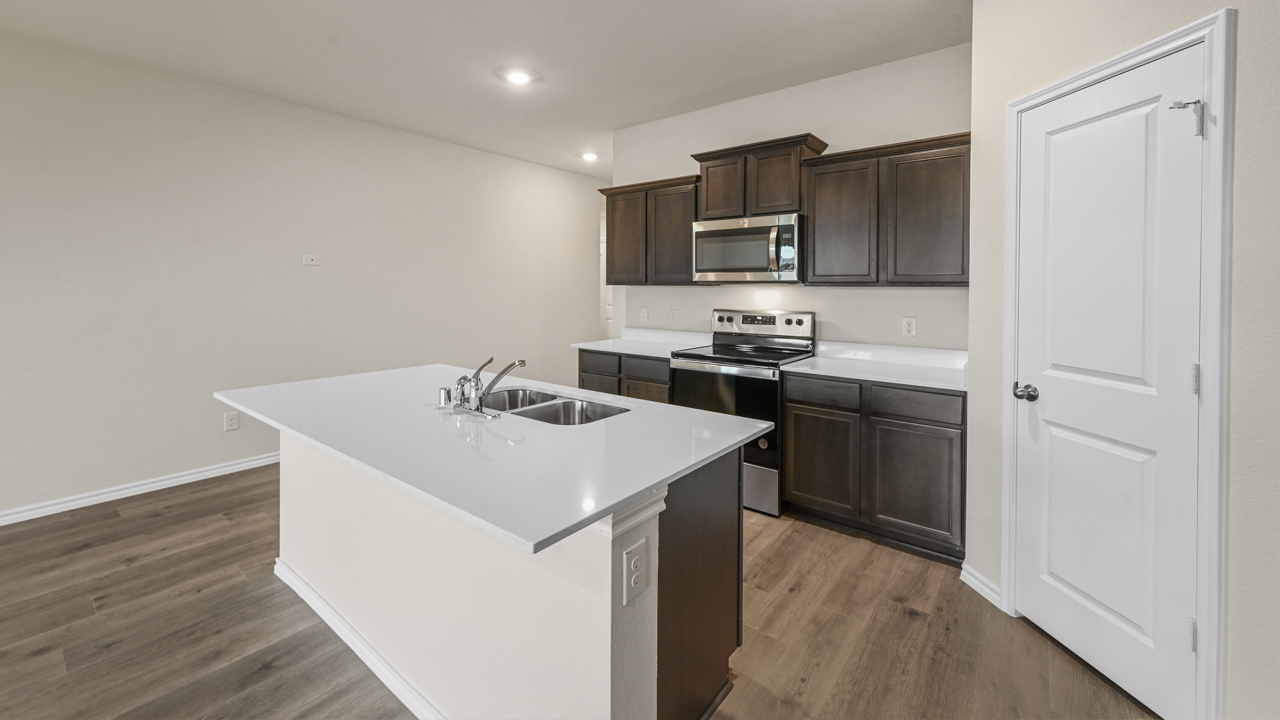 kitchen with large island and white counters