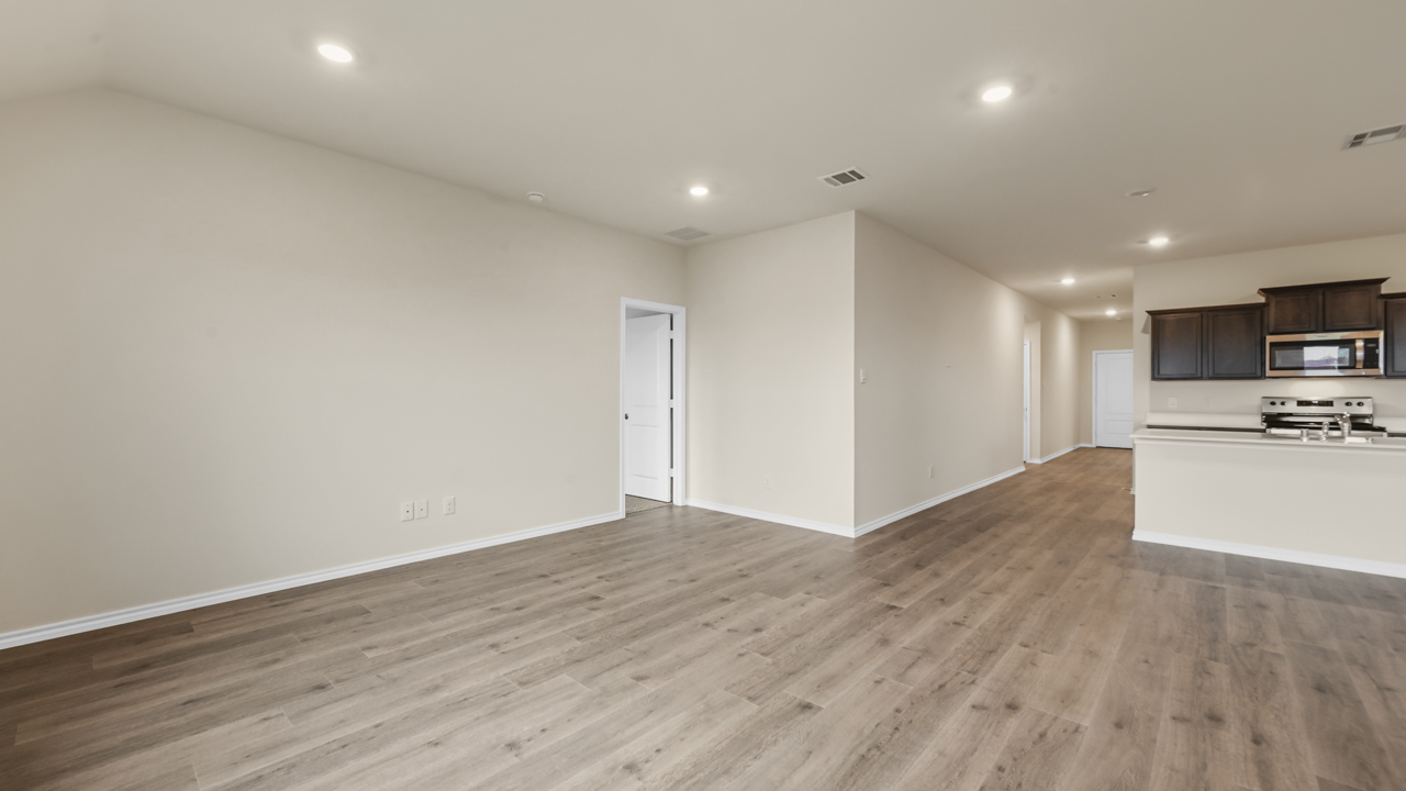 living area with hardwood flooring and natural lighting