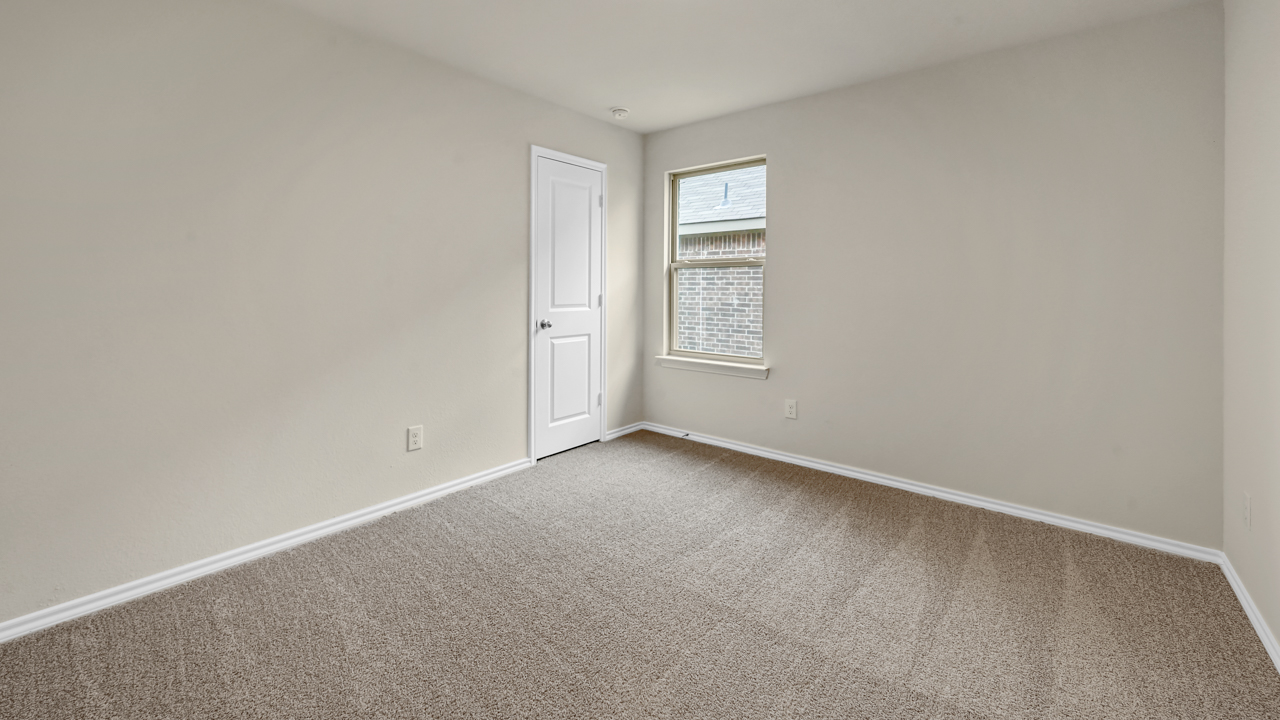 secondary bedroom with carpet floors