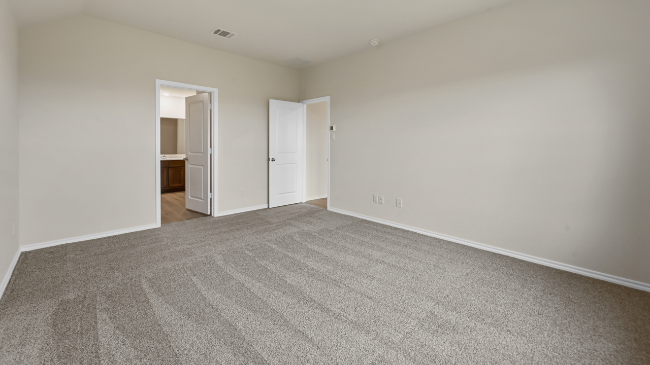 primary bedroom with carpet