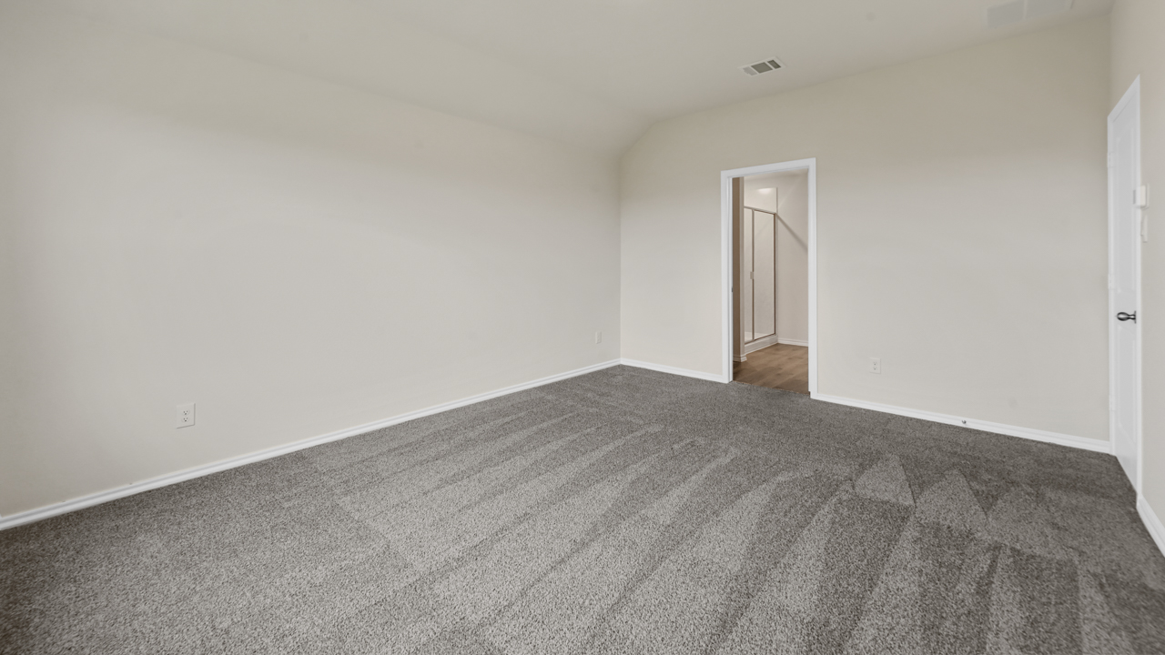 primary bedroom with carpet