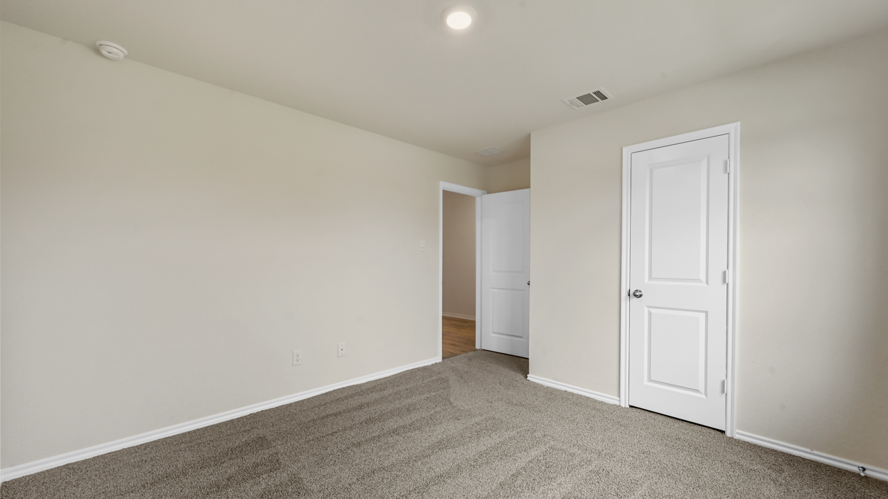 secondary bedroom with carpet