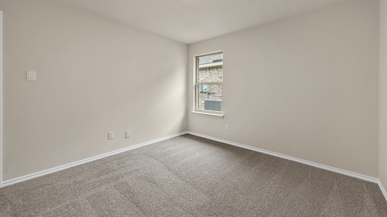 secondary bedroom with carpet