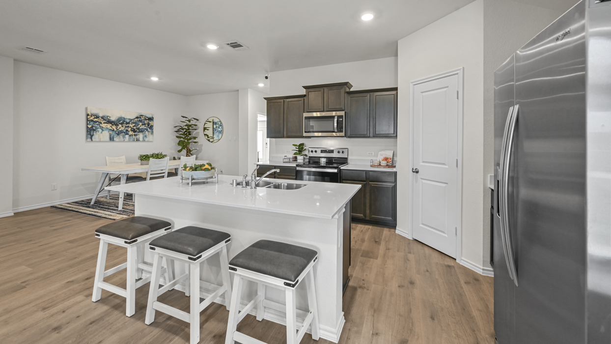 kitchen with stainless steel appliances and white counters