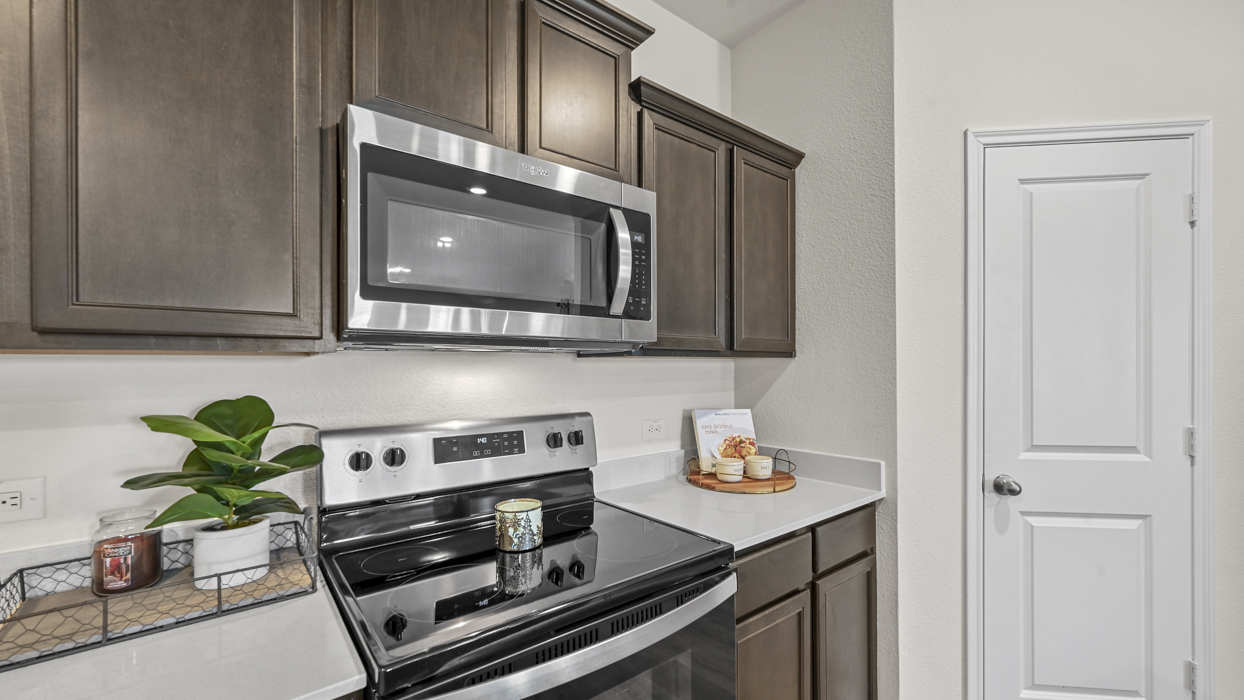 kitchen with brown cabinets and white countertops
