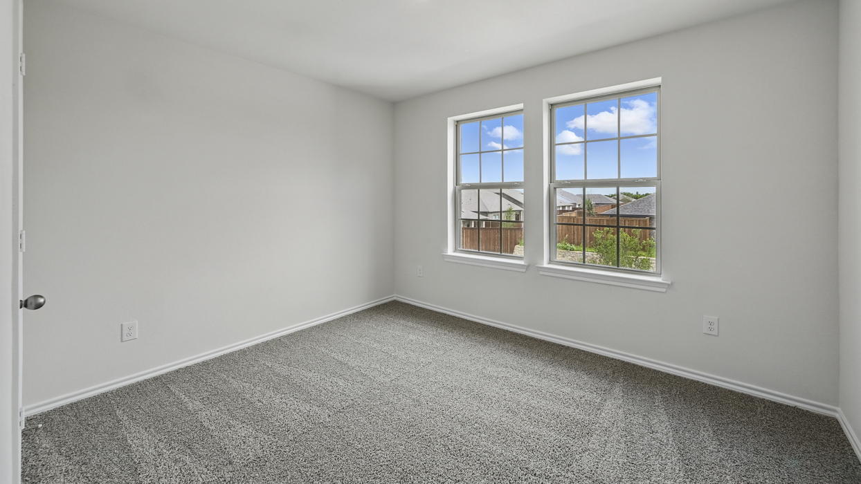 bedroom 4 on second story with carpeted floors