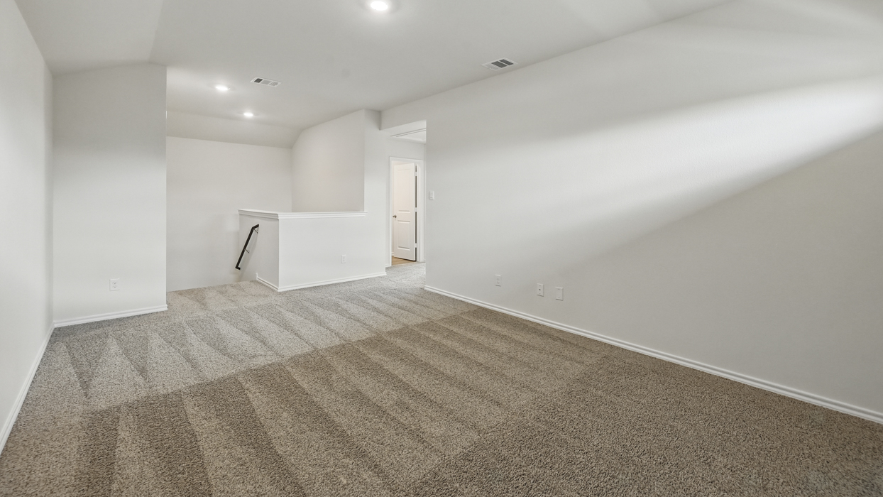 game room on second story with carpeted floors