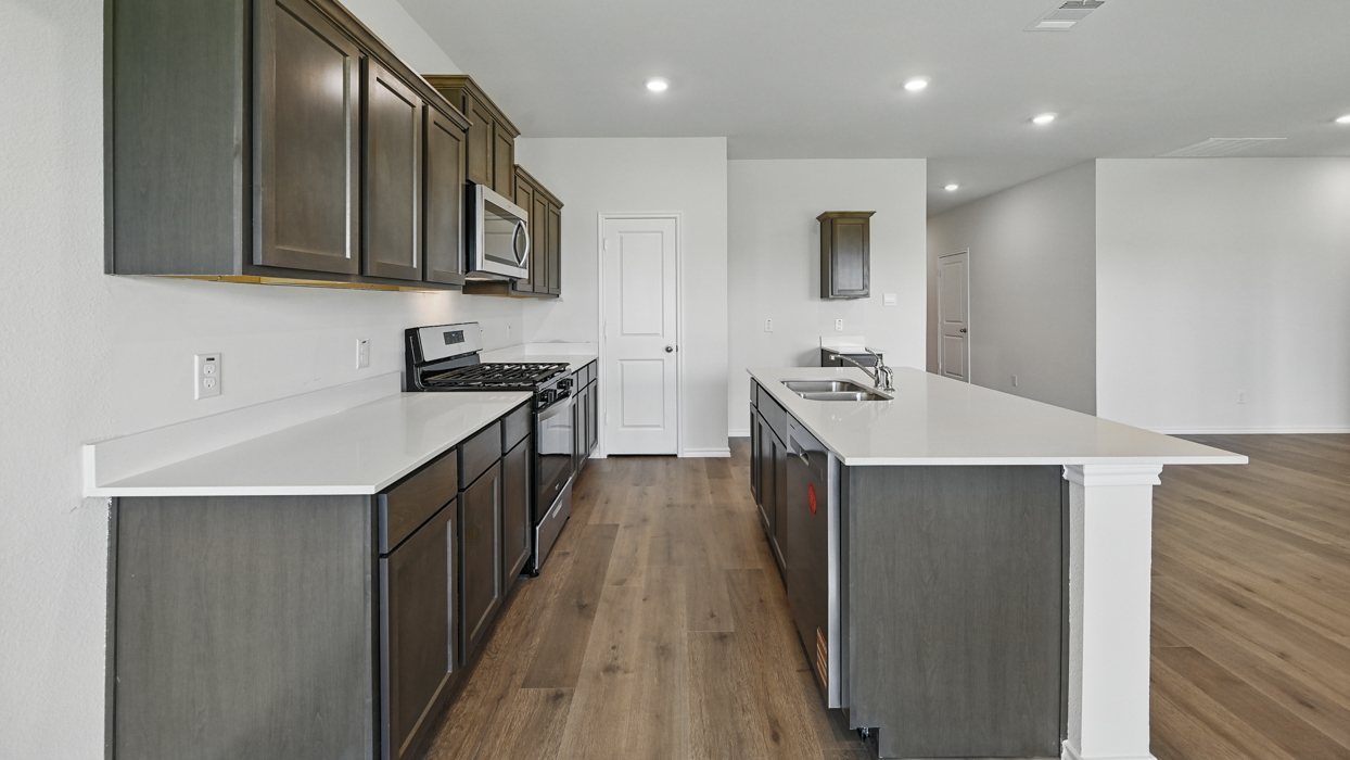 kitchen with island and brown cabinets