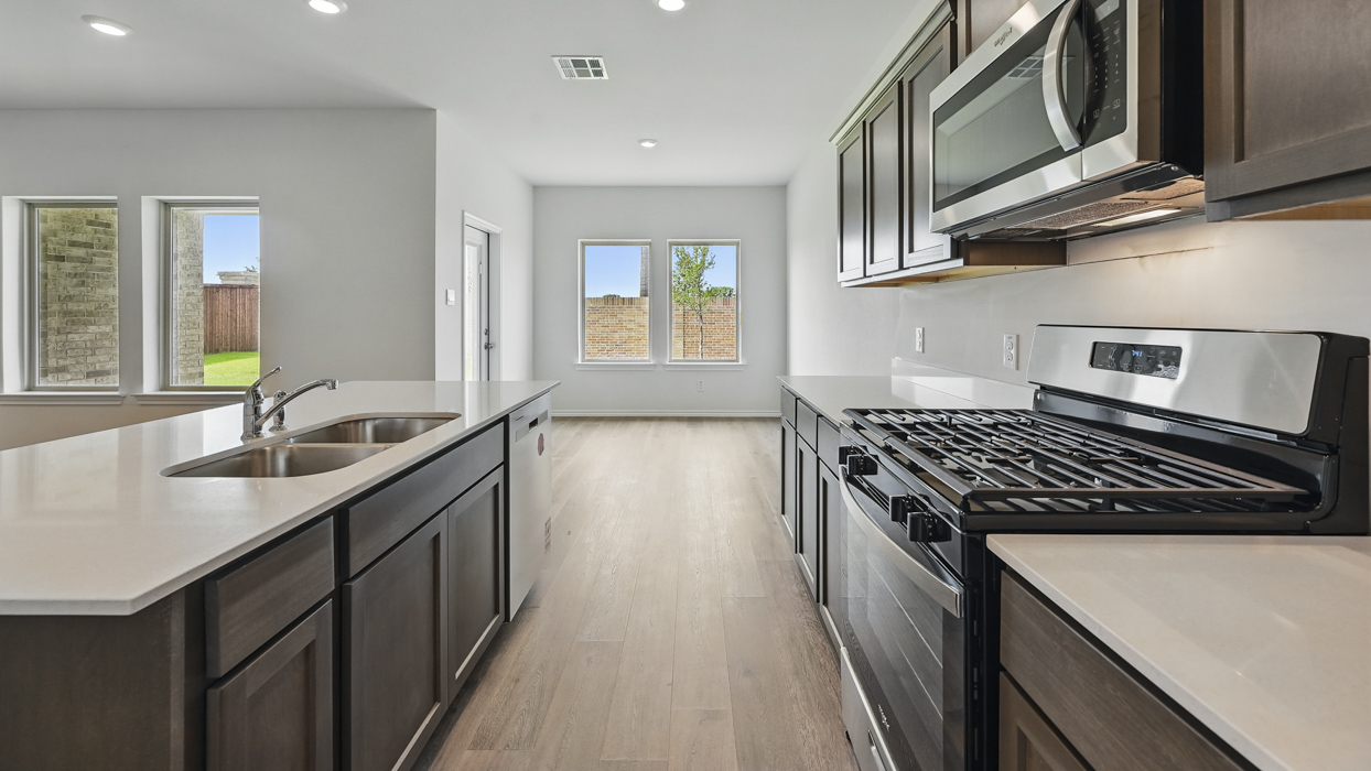 kitchen with white counters and stainless steel appliances
