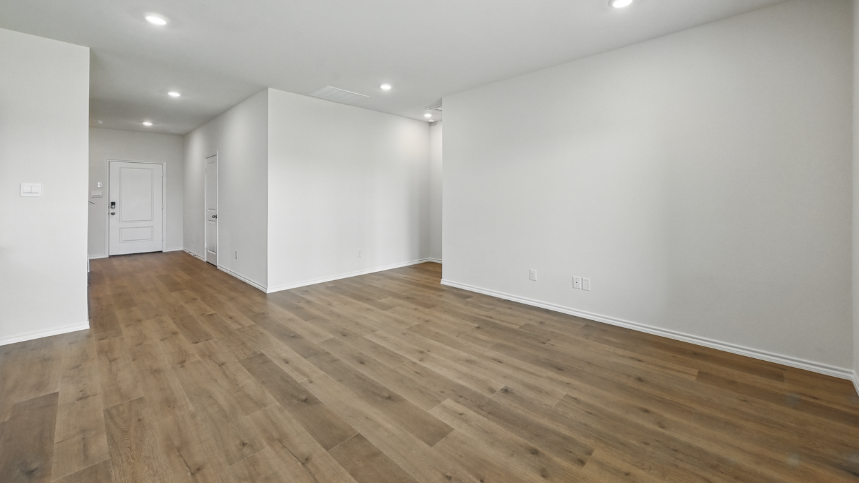 living room with natural lighting and hardwood flooring