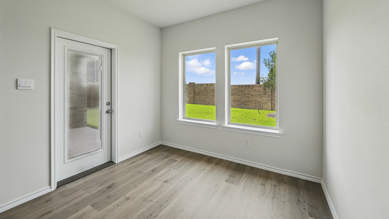 nook with door leading to backyard