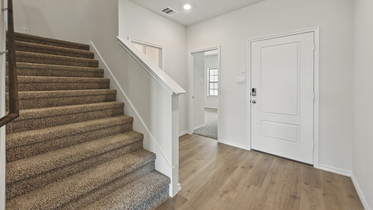 entry way leading to second story stairs
