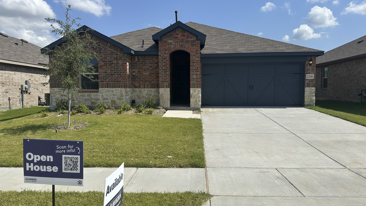 exterior of one story home with brick exterior
