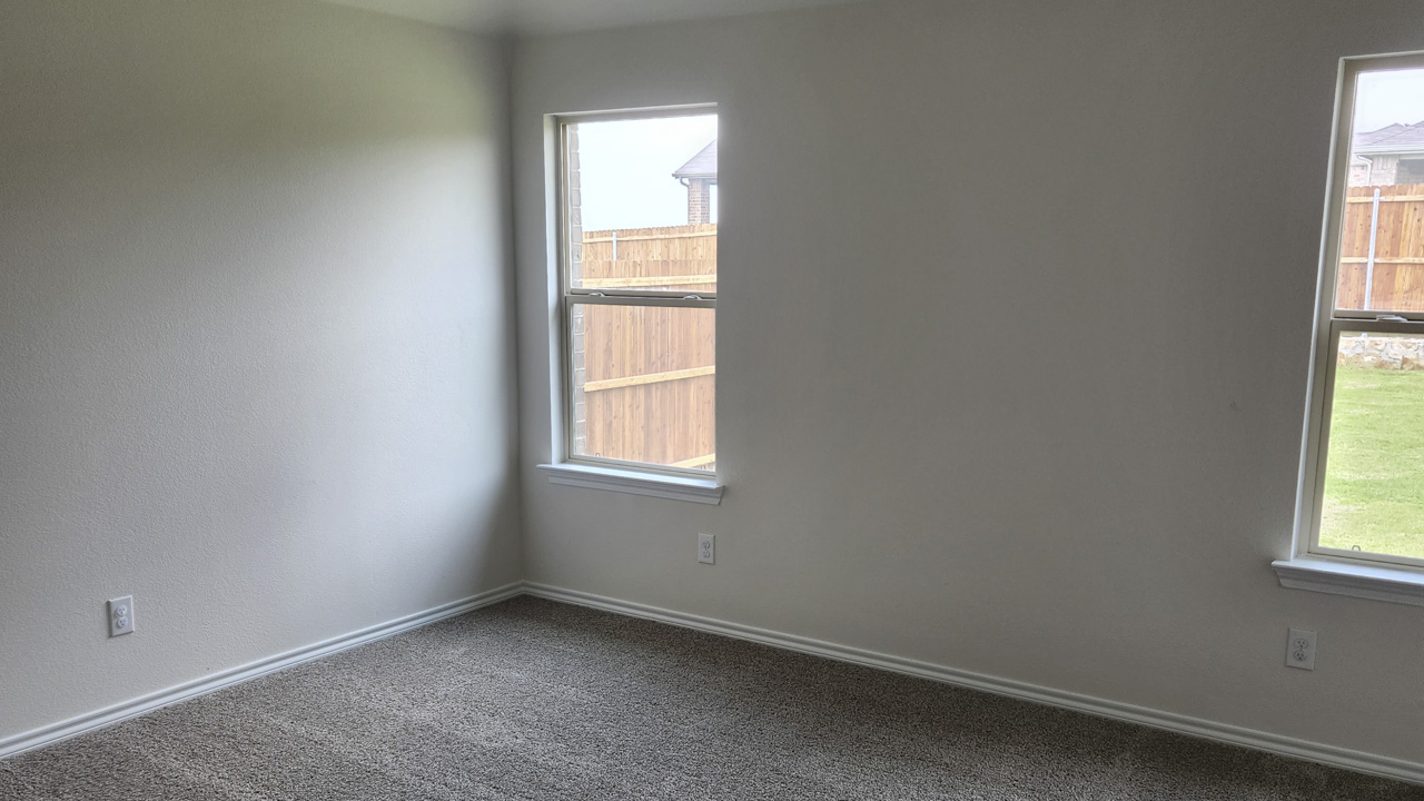 primary bedroom with large windows