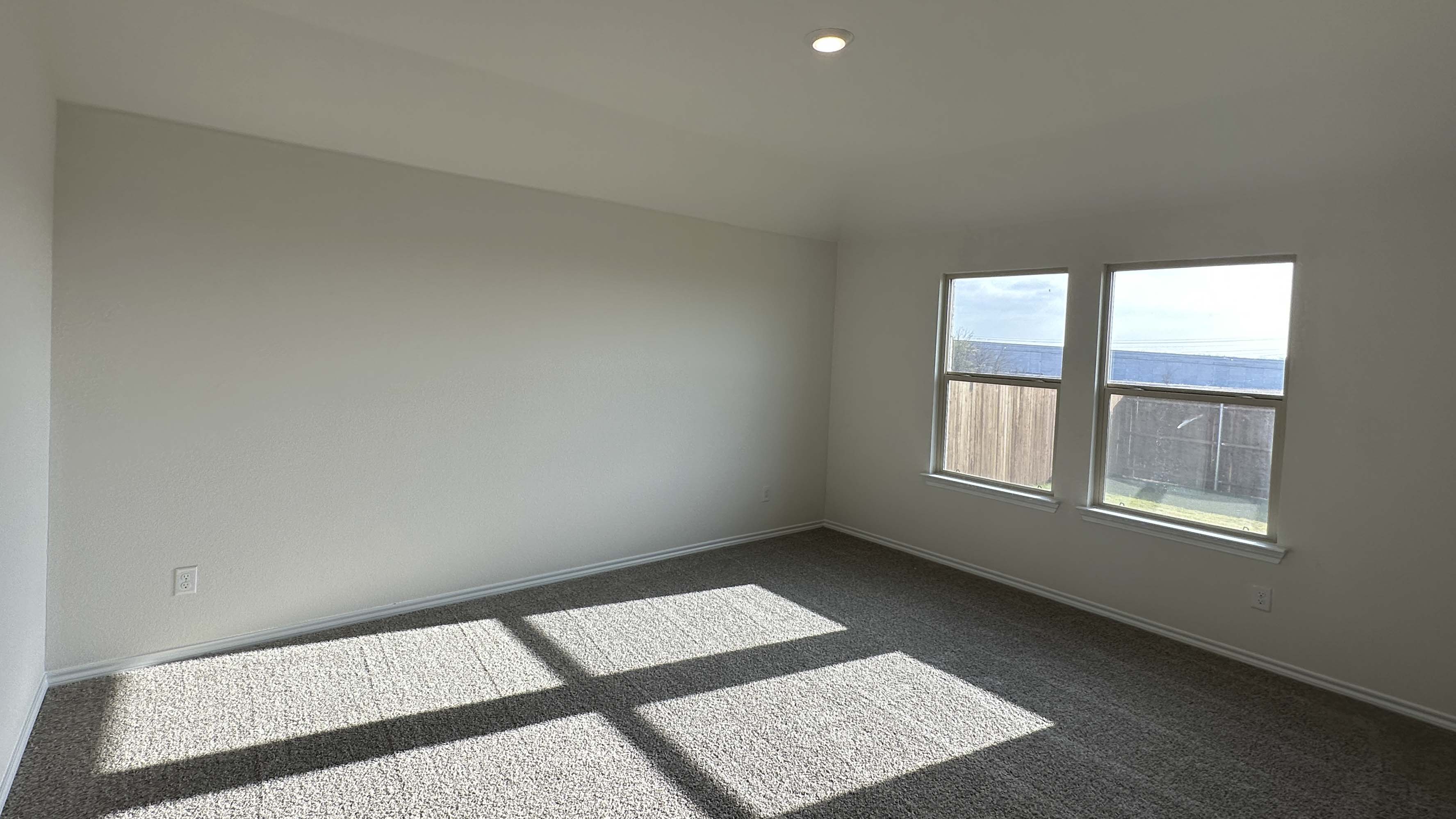 primary bedroom with natural light