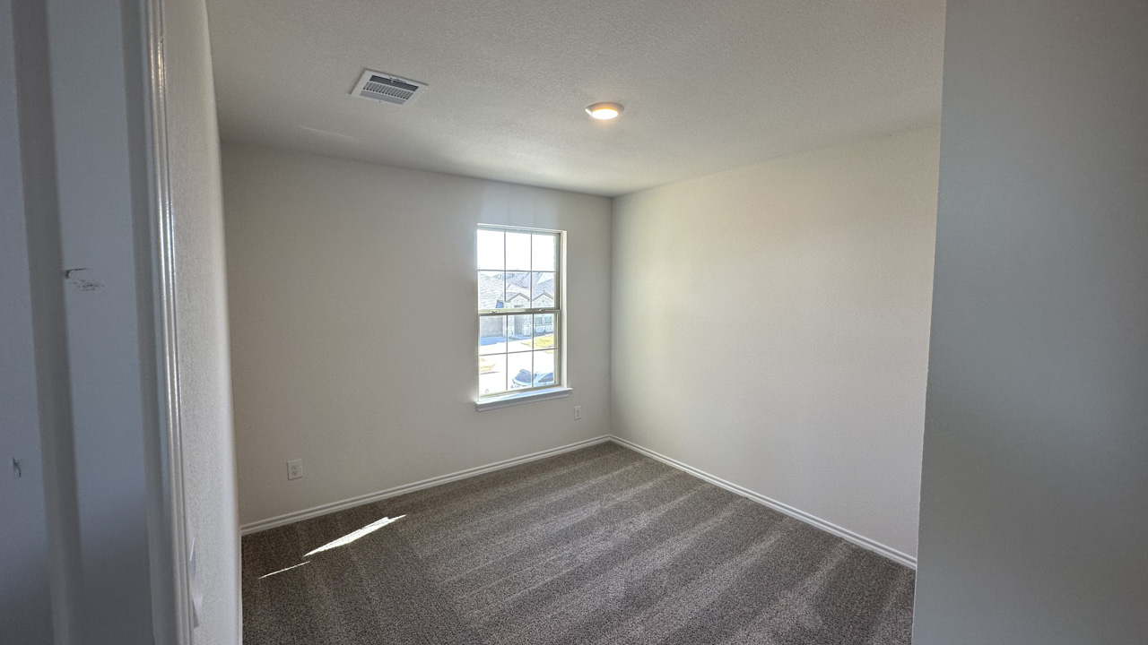 secondary bedroom with large window