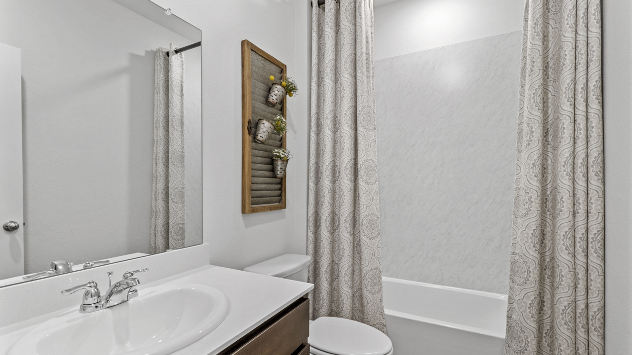 X40N secondary bathroom with white counters and shower