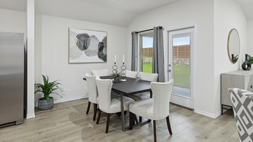 2106 Woodrose Court One-story model at Cartwright Ranch in Crandall, TX dining area with hardwood floors