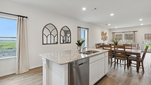 2110 Woodrose Court two-story model at Cartwright Ranch in Crandall, TX kitchen area with view dining area