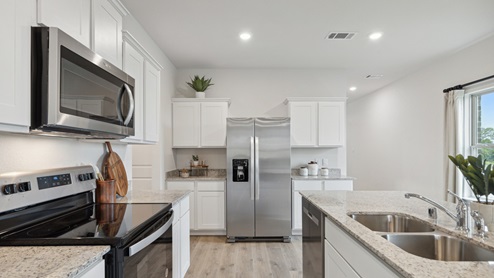 2110 Woodrose Court two-story model at Cartwright Ranch in Crandall, TX kitchen area