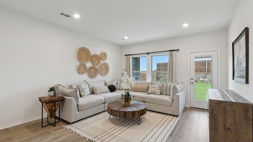 2110 Woodrose Court two-story model at Cartwright Ranch in Crandall, TX open concept living area with natural lighting