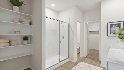 2110 Woodrose Court two-story model at Cartwright Ranch in Crandall, TX primary bathroom with hardwood floors
