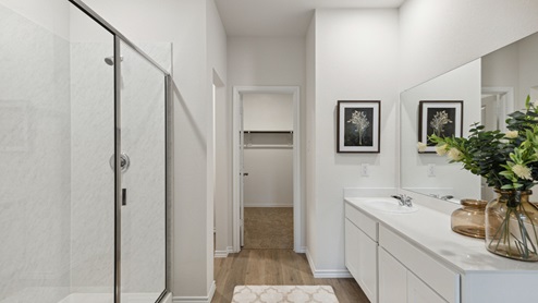 2110 Woodrose Court two-story model at Cartwright Ranch in Crandall, TX primary bathroom with hardwood floors