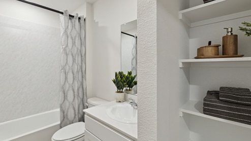 2110 Woodrose Court two-story model at Cartwright Ranch in Crandall, TX secondary bathroom with white counters and cabinets