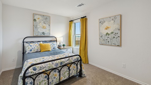 2110 Woodrose Court two-story model at Cartwright Ranch in Crandall, TX secondary bedroom with carpet and windows