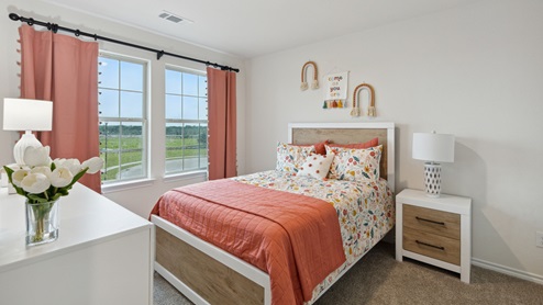 2110 Woodrose Court two-story model at Cartwright Ranch in Crandall, TX secondary bedroom with carpet and windows